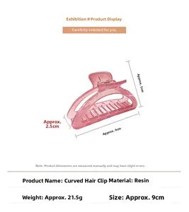 Pink translucent crescent hair claw with 9cm length and resin texture details