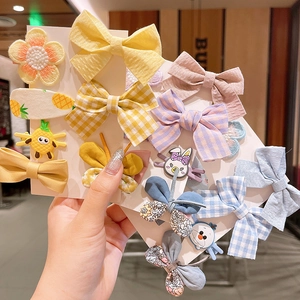 Set accessori per capelli bimba con fiocchi in tessuto e ciondoli a cartone animato