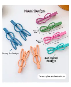 Detailed macro view of matte Morandi colored hair clips in rabbit ear and heart shapes