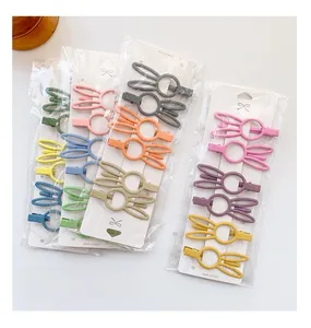 Cute bunny ear hair clips in pastel colors with individual retail card packaging