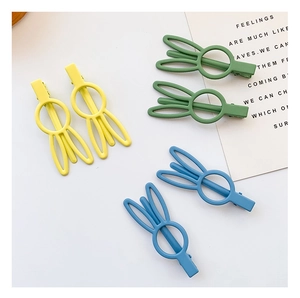 Close-up of 6pcs matte rabbit ear hair clips in yellow, green, and blue candy colors