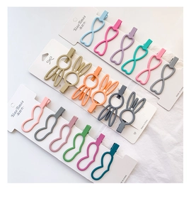 Close-up of matte Korean bunny and heart hair clips set on display cards