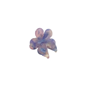 Floral acetate hair claw clip with colorful marble pattern on white background
