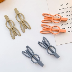 Three pairs of cute matte bunny ear hair clips in Morandi colors with duckbill metal grips