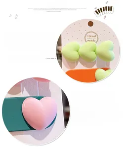 Détails des pinces à cheveux en forme de cœur, couleurs pastel mates et texture lisse