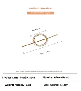 Detail view of pearl hair pin with gold alloy ring and dimensions 12.2cm in length
