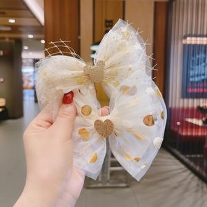 Handmade white mesh bow hair clips featuring gold sequin stars and iconic mouse shapes