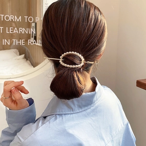 Elegant Korean style pearl hair pin set with a golden metal stick for bun hairstyles