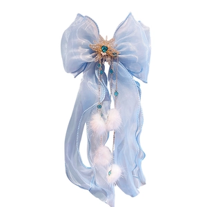 Barrette à nœud bleu élégant avec gemme en cœur, étoile dorée et pompons doux