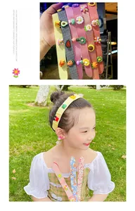 Detail of colorful cartoon hair velcro strips with cute resin charms for children