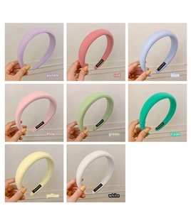 Detail showing eight candy colors of thickened sponge headbands with handmade labels