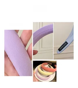 Detailed view of candy-colored thick sponge headband with knitting texture and handmade label
