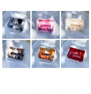 Detailed grid view of six colored marble pattern acetate hair claw clips for hair styling