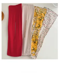 Flat lay of floral fabric deft buns in red, beige, and yellow floral patterns