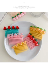 Detail of colorful children hair combs with cartoon fruit and rabbit decorations
