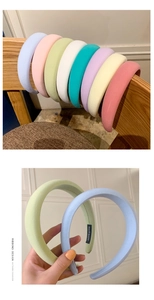 Detail of padded candy color sponge headbands in eight soft pastel shades with handmade label
