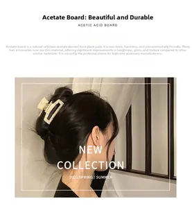 Detail of eco-friendly acetate hair claw with ivory marble texture and rectangular hollow design