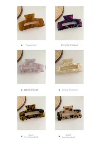 Detail showing various colors and textures of large square hollow hair claws