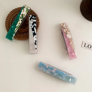 Elegant rectangle acetate hair clips in emerald green, pink, and blue marble patterns