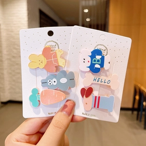 Detailed close-up of cute cartoon hair clips set for girls featuring bunny and bear designs