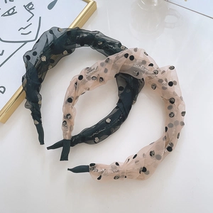 Set of two pleated chiffon bunny ear headbands with polka dots in black and champagne