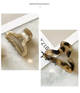 Detail showing elegant acetate hair claws in cream and tortoiseshell finishes