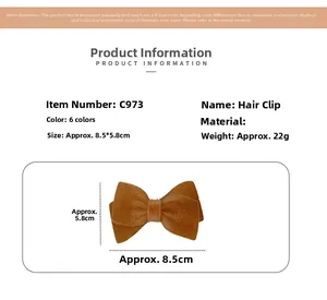 Close-up of a brown flocked bow hair clip showing detailed size 8.5x5.8cm and texture