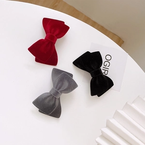 Elegant velvet bow hair clip set in wine red, black, and grey with classic metal spring clips