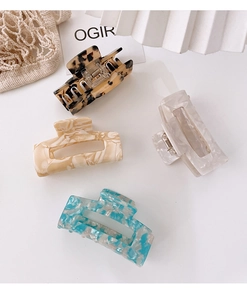 Detailed set of four rectangular acetate hair claws with marble and tortoiseshell patterns