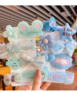 Détail de 12 barrettes à cheveux mignonnes avec nœuds et fleurs pour filles sur cartes
