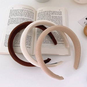Three minimalist thick sponge headbands in brown, cream white, and beige colors