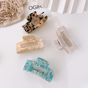 Set of four tortoiseshell and floral acetate hair claws in geometric rectangle shapes