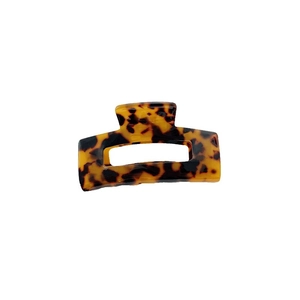 Classic rectangle acetate hair claw clip with tortoise shell leopard pattern on white background