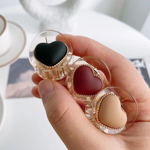 Three-piece mini heart hair claws in black, burgundy and beige with gold beaded borders