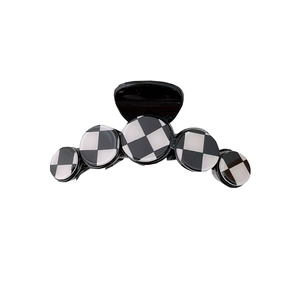 Black and white checkerboard hair claw clip with a creative five-disk curved design