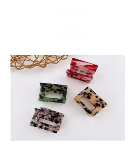 Detailed set of 4 acetate hair claws with marble and tortoiseshell patterns