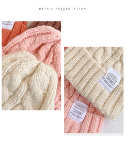 Detail showing various colors of thick knit winter beanies with blankverse label