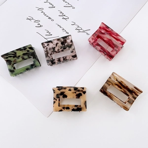 Five assorted marble acetate square hair claws in elegant tortoiseshell patterns