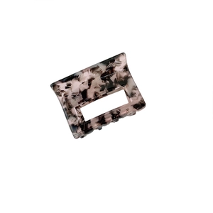 Minimalist square acetate hair claw clip with black and grey marble pattern texture
