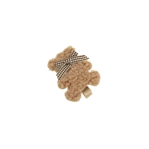 Pince à cheveux ours en peluche marron avec nœud à carreaux sur fond blanc épuré