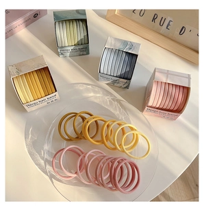 Close-up of assorted high-elasticity colorful hair bands in stylish gift box packaging