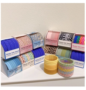 Detail of colorful elastic hair bands in candy colors with high-stretch braided texture