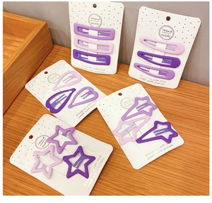 Set di fermagli per capelli geometrici viola opachi in varie forme su cartellini