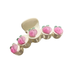 Pince à cheveux pêche en acrylique blanc crème avec cinq jolies décorations de pêches roses