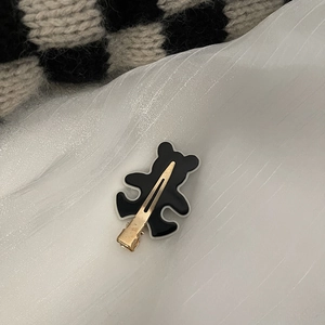 Barrette ours noir mignonne avec contour blanc et pince crocodile en métal doré