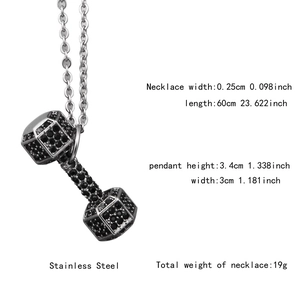 Macro shot of hip hop dumbbell pendant in stainless steel with black micro-inlaid stones