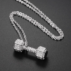 Hip hop dumbbell pendant necklace in silver with full diamond setting on black background