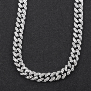 Close-up of hip-hop silver plated Cuban link necklace with iced out pavé set rhinestones