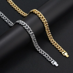 Hip-hop iced out Cuban link chain in gold and silver finish with secure folding clasp