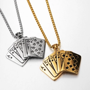 Macro detail of royal flush poker card pendant in gold and silver stainless steel